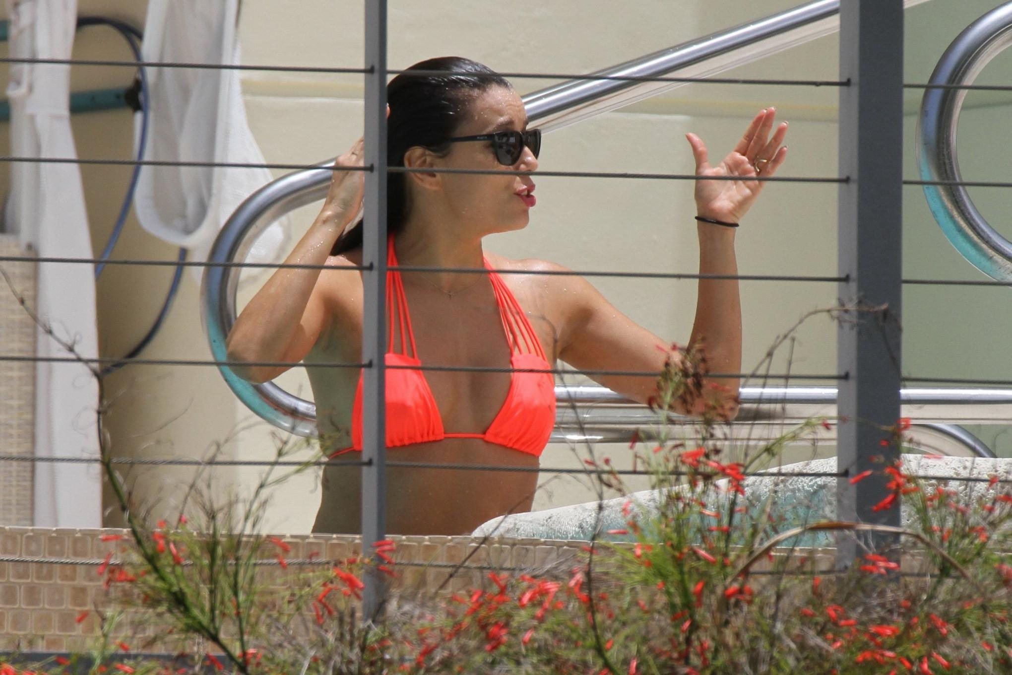 16P Eva Longoria shows nipple pokies in orange bikini poolside