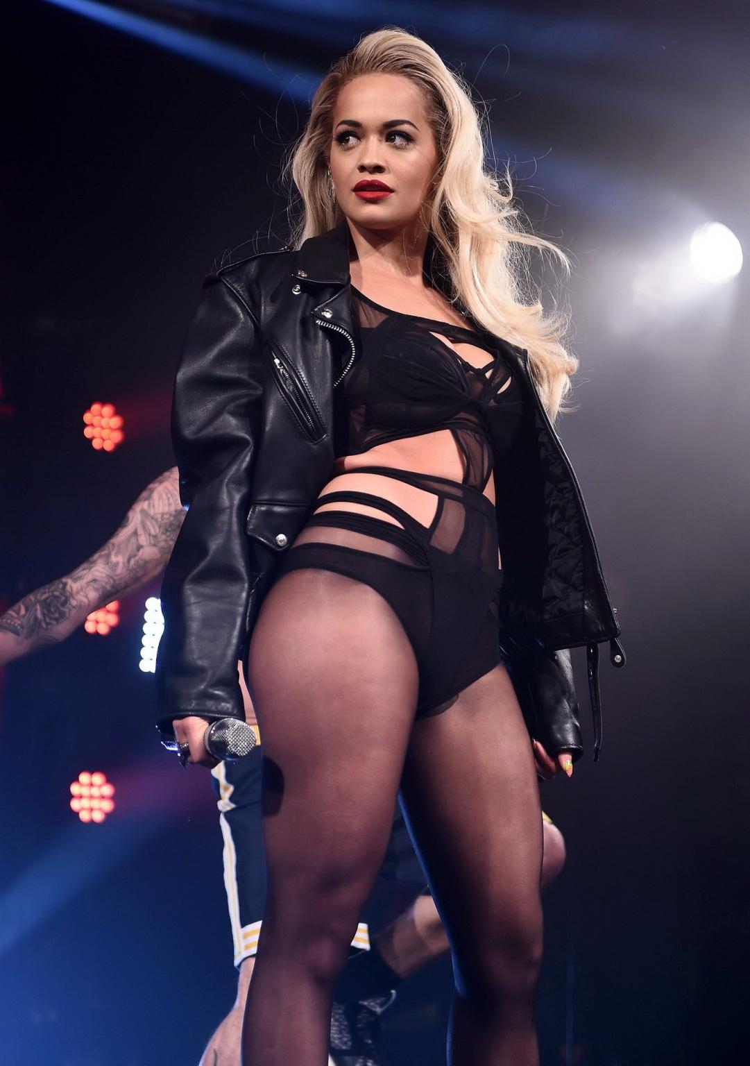 16P Rita Ora shows off her ass and cleavage in black bodysuit