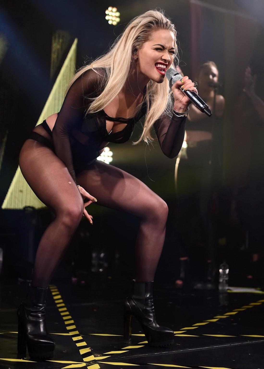 16P Rita Ora shows off her ass and cleavage in black bodysuit