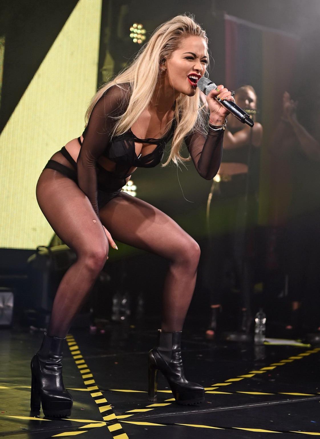 16P Rita Ora shows off her ass and cleavage in black bodysuit