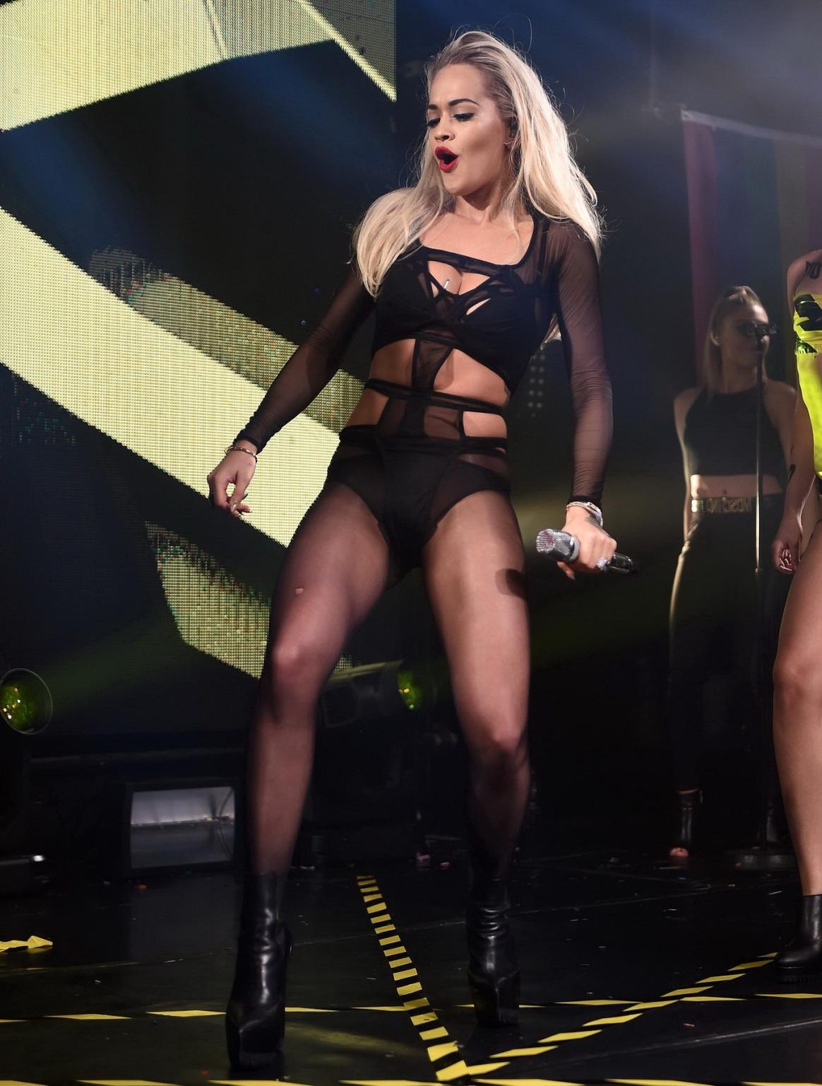 16P Rita Ora shows off her ass and cleavage in black bodysuit