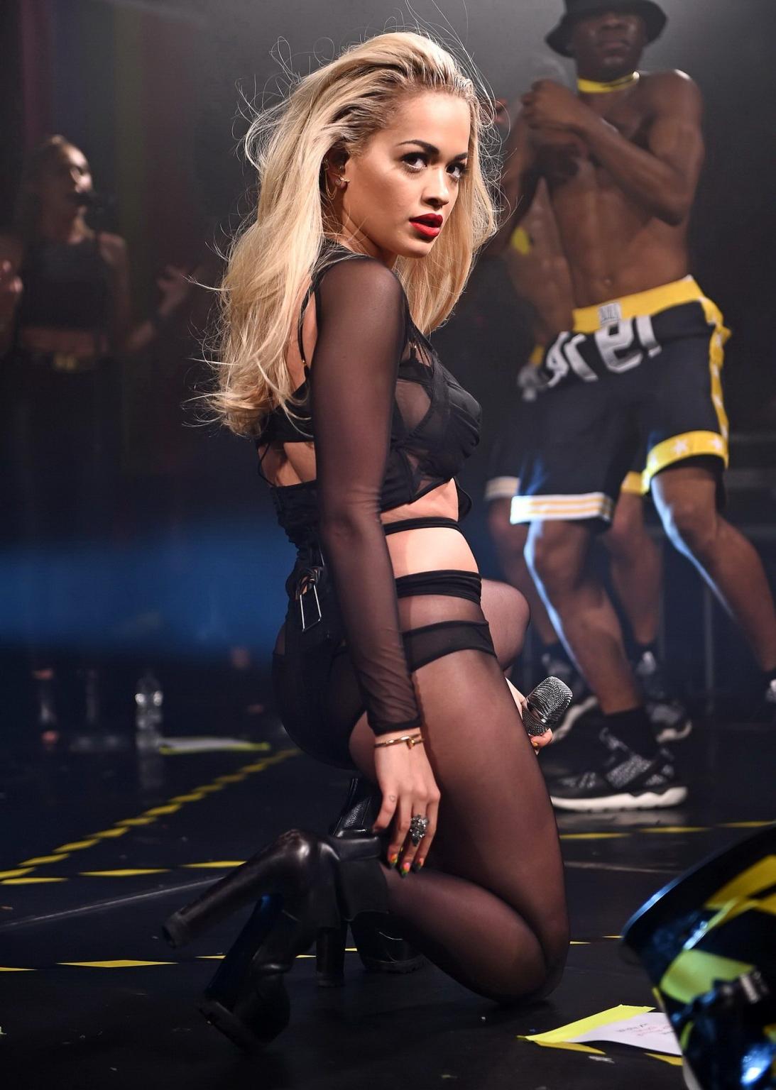 16P Rita Ora shows off her ass and cleavage in black bodysuit