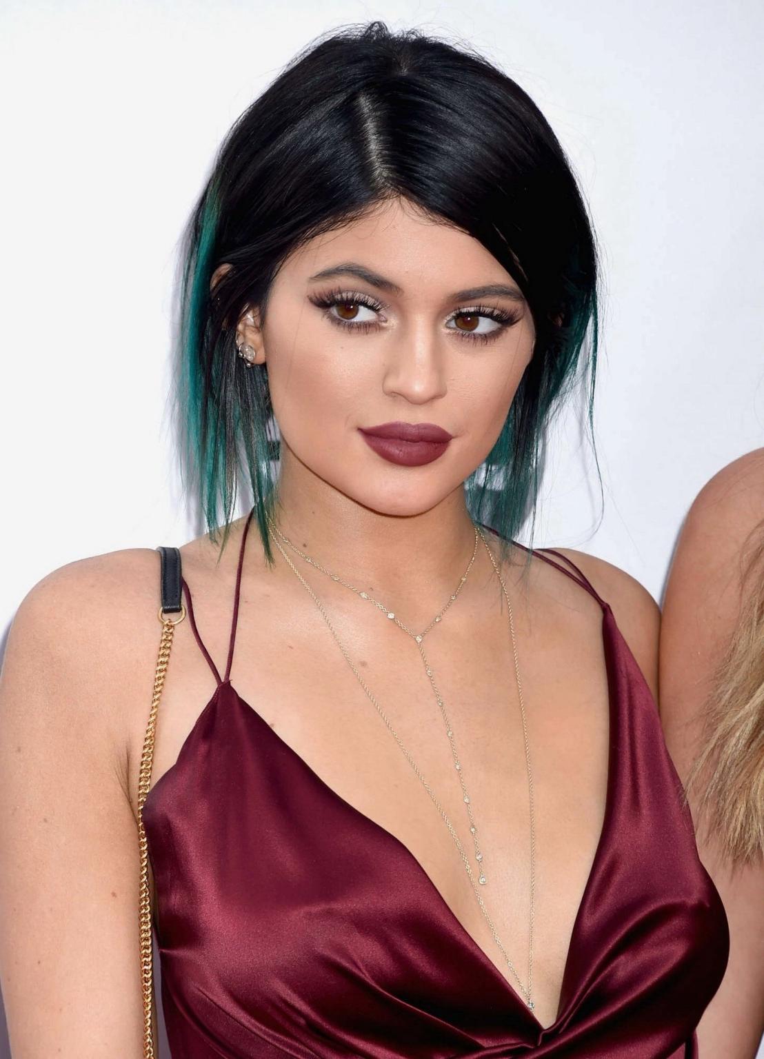 16P Kylie Jenner showing huge cleavage and leggy