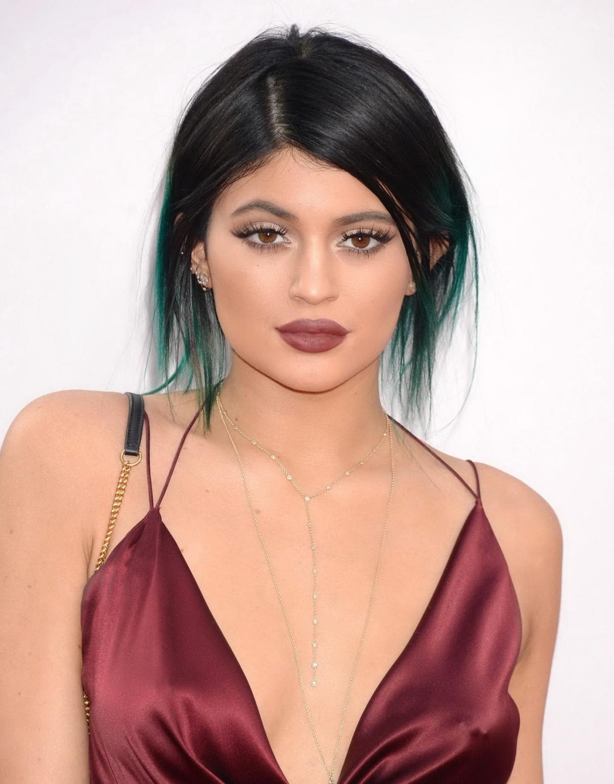 16P Kylie Jenner showing huge cleavage and leggy