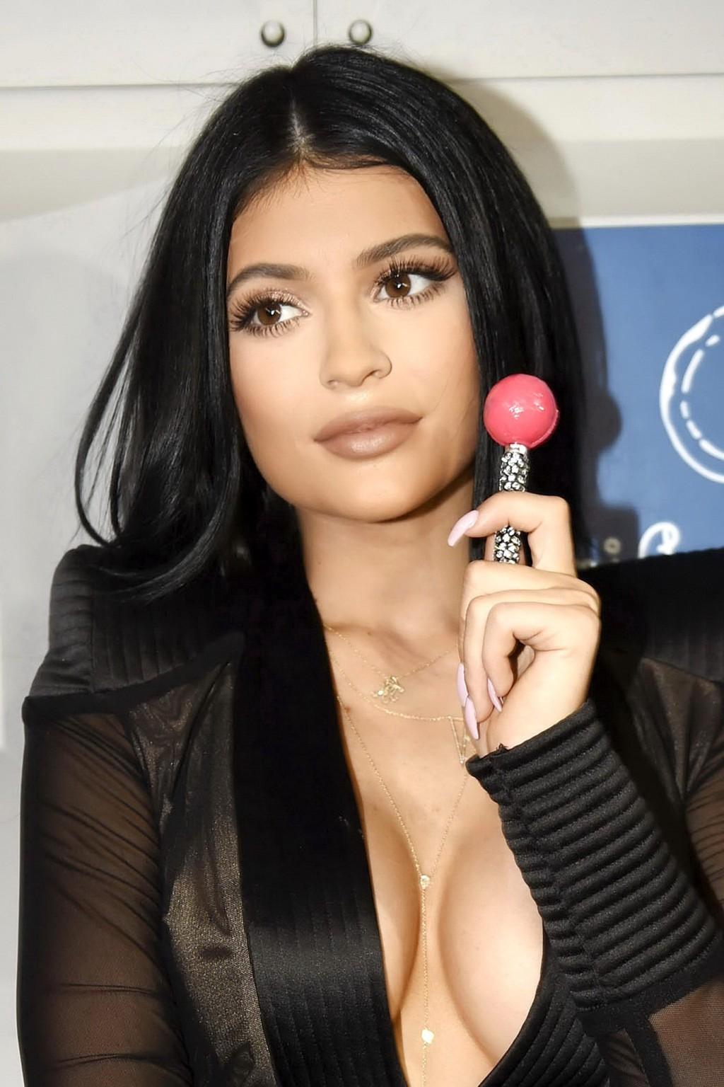 16P Kylie Jenner showing huge cleavage at the Sugar Factory Opening