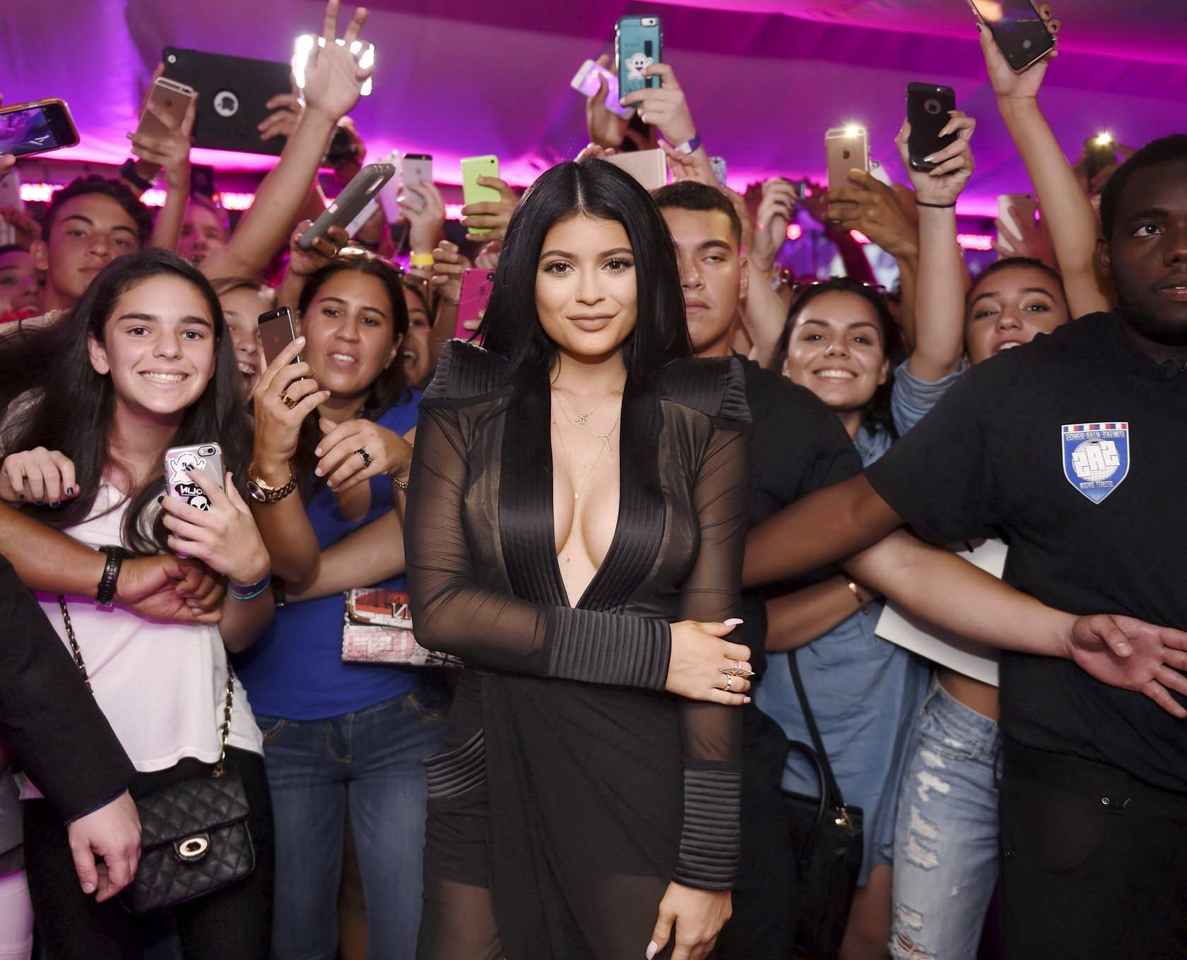 16P Kylie Jenner showing huge cleavage at the Sugar Factory Opening