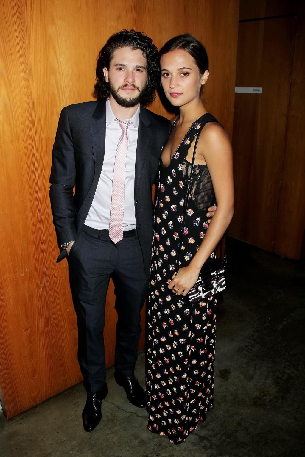 16P Alicia Vikander shows cleavage  side boob attending the Testament of Youth premi