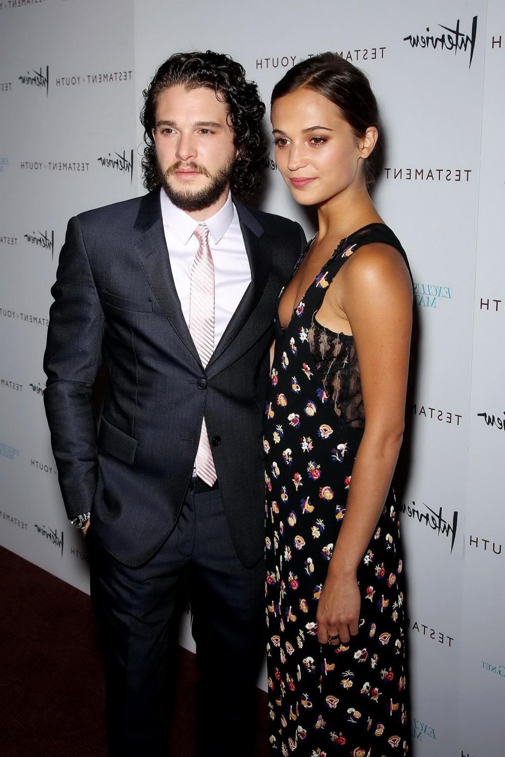 16P Alicia Vikander shows cleavage  side boob attending the Testament of Youth premi
