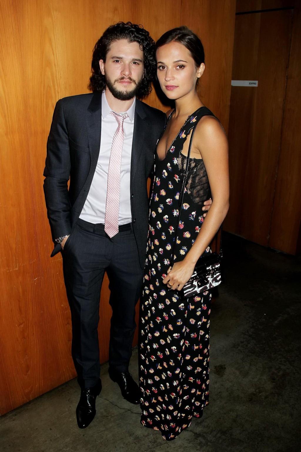 16P Alicia Vikander shows cleavage  side boob attending the Testament of Youth premi