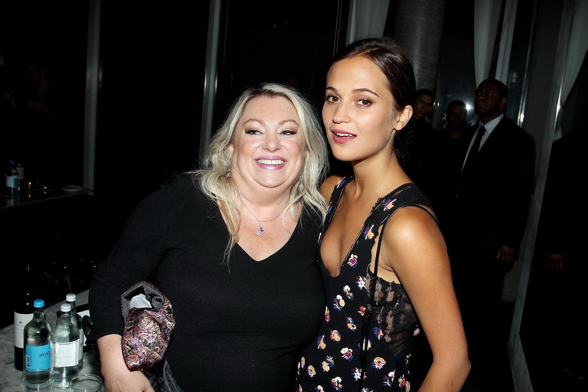 16P Alicia Vikander shows cleavage  side boob attending the Testament of Youth premi