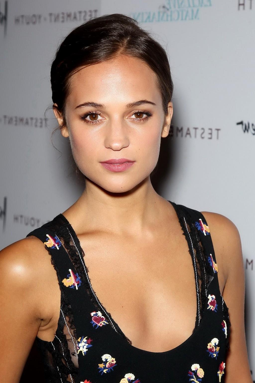 16P Alicia Vikander shows cleavage  side boob attending the Testament of Youth premi