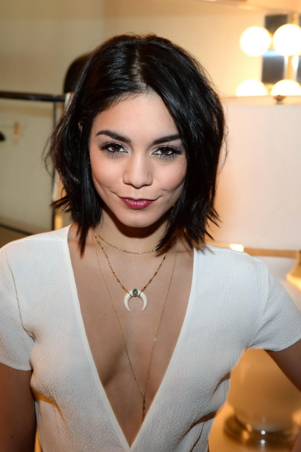 16P Vanessa Hudgens braless showing huge cleavage in white backless jumpsuit at back
