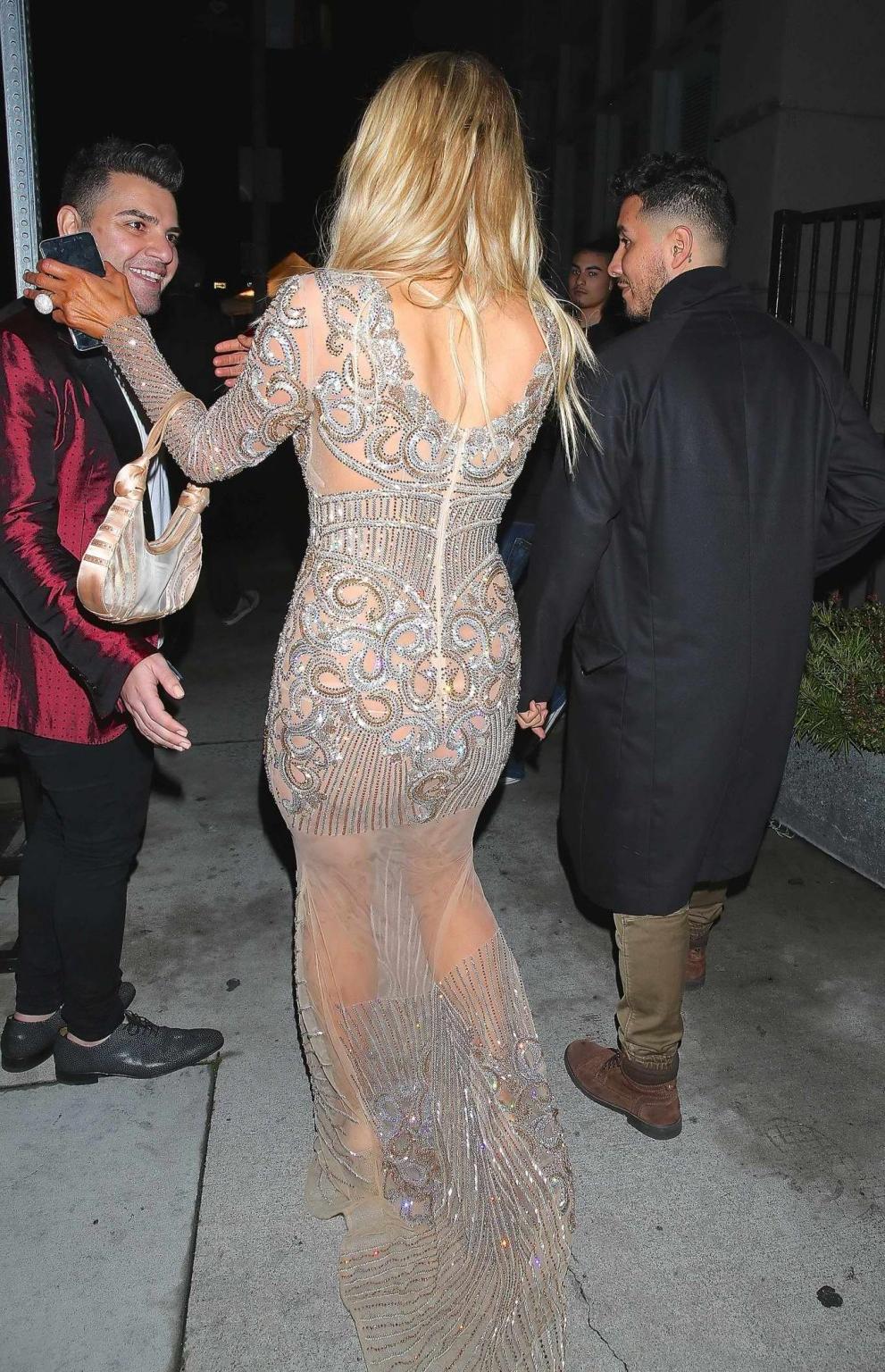 16P Paris Hilton wears only tiny panties under a transparent lace dress at the Charb
