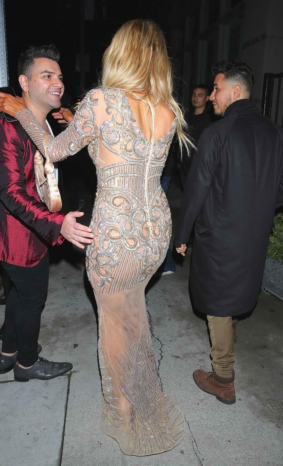 16P Paris Hilton wears only tiny panties under a transparent lace dress at the Charb