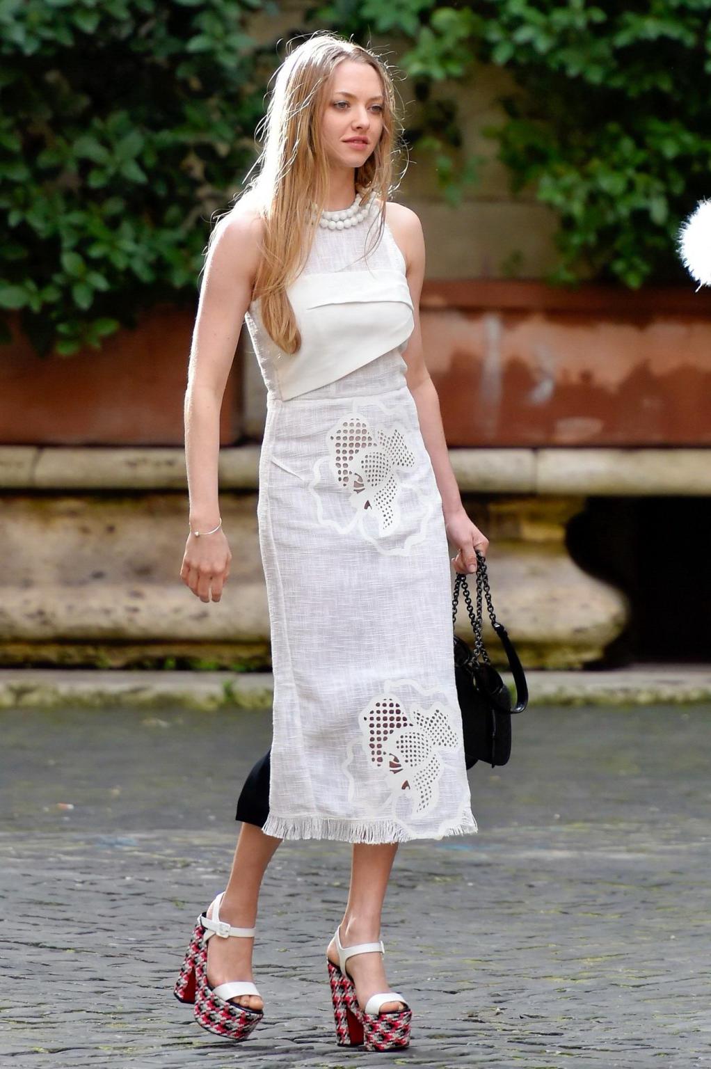 16P Amanda Seyfried showing cleavage and upskirt at the photoshoot in Rome