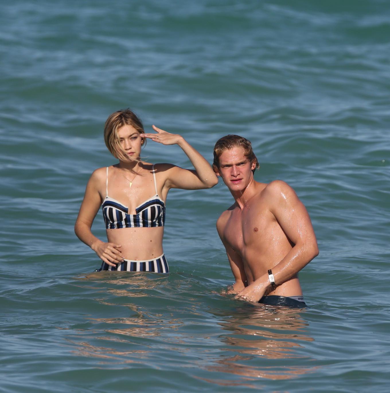 16P Gigi Hadid showing off her hot body in a striped retro bikini at Miami Beach