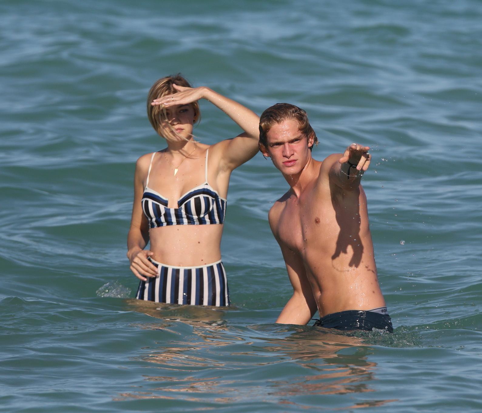 16P Gigi Hadid showing off her hot body in a striped retro bikini at Miami Beach