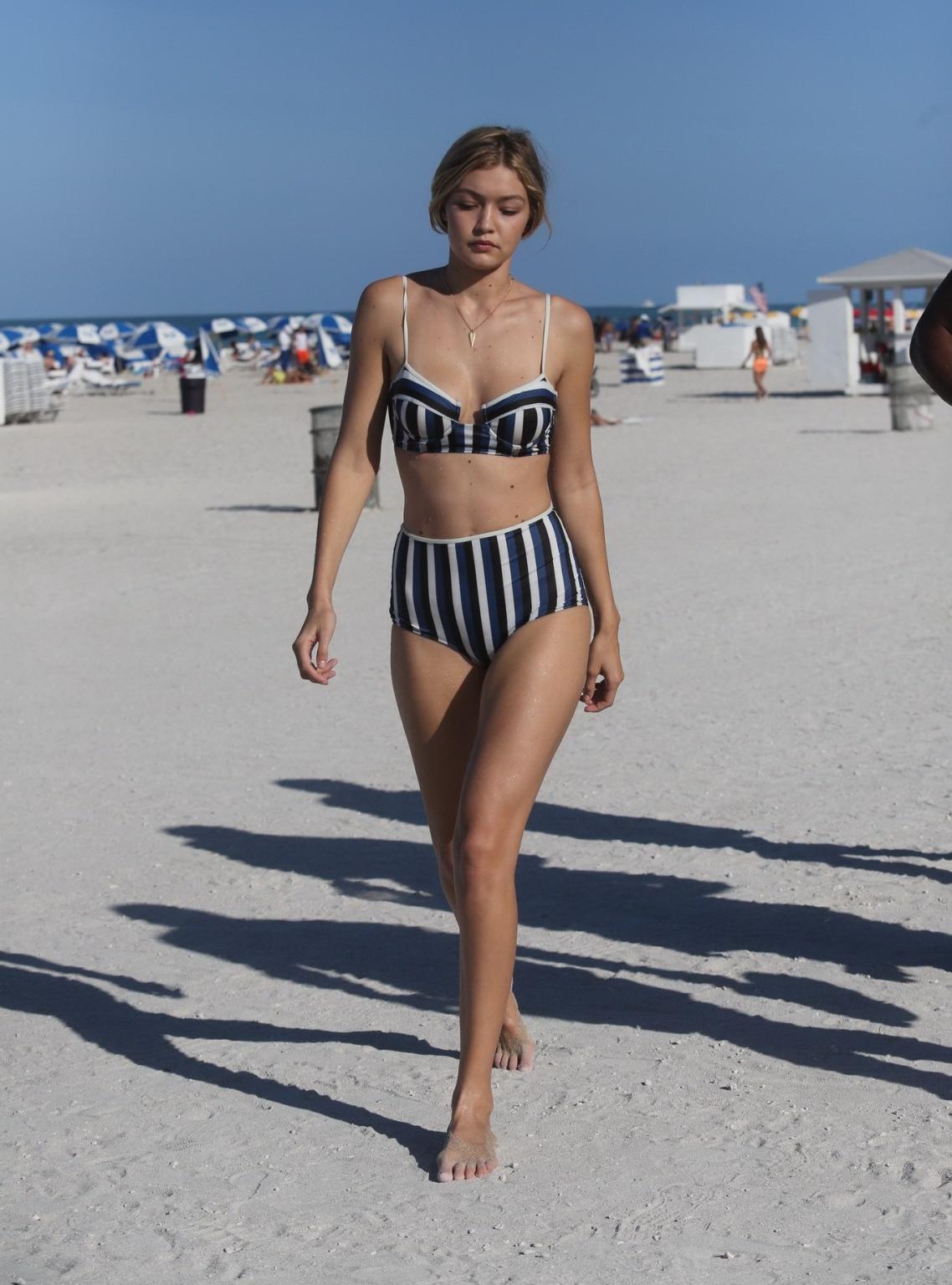 16P Gigi Hadid showing off her hot body in a striped retro bikini at Miami Beach