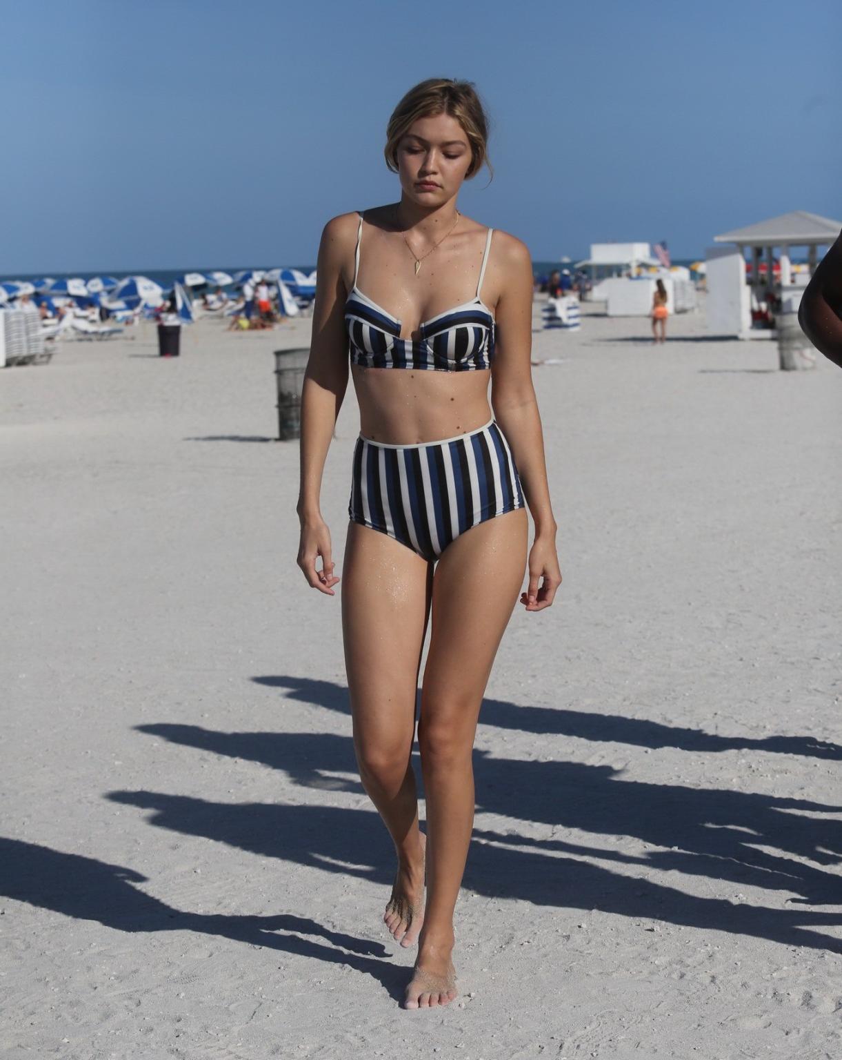 16P Gigi Hadid showing off her hot body in a striped retro bikini at Miami Beach