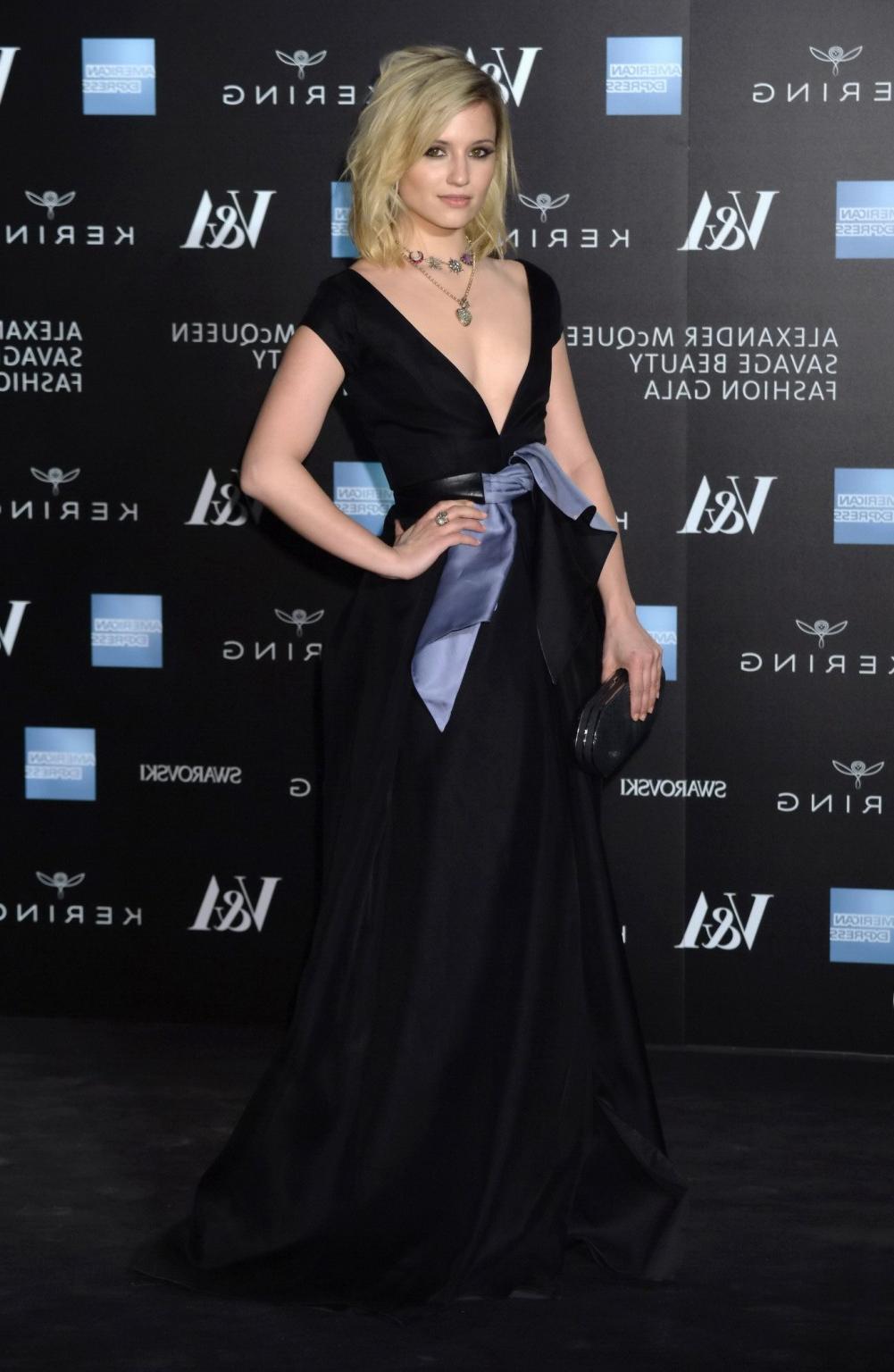 16P Dianna Agron nipple slip in a low cut black dress while arriving at Alexander Mc