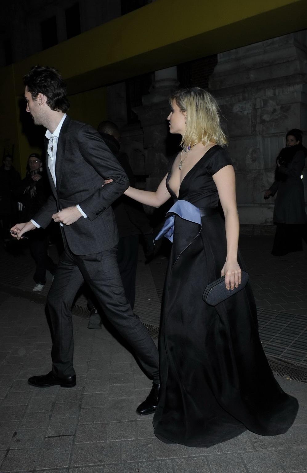 16P Dianna Agron nipple slip in a low cut black dress while arriving at Alexander Mc