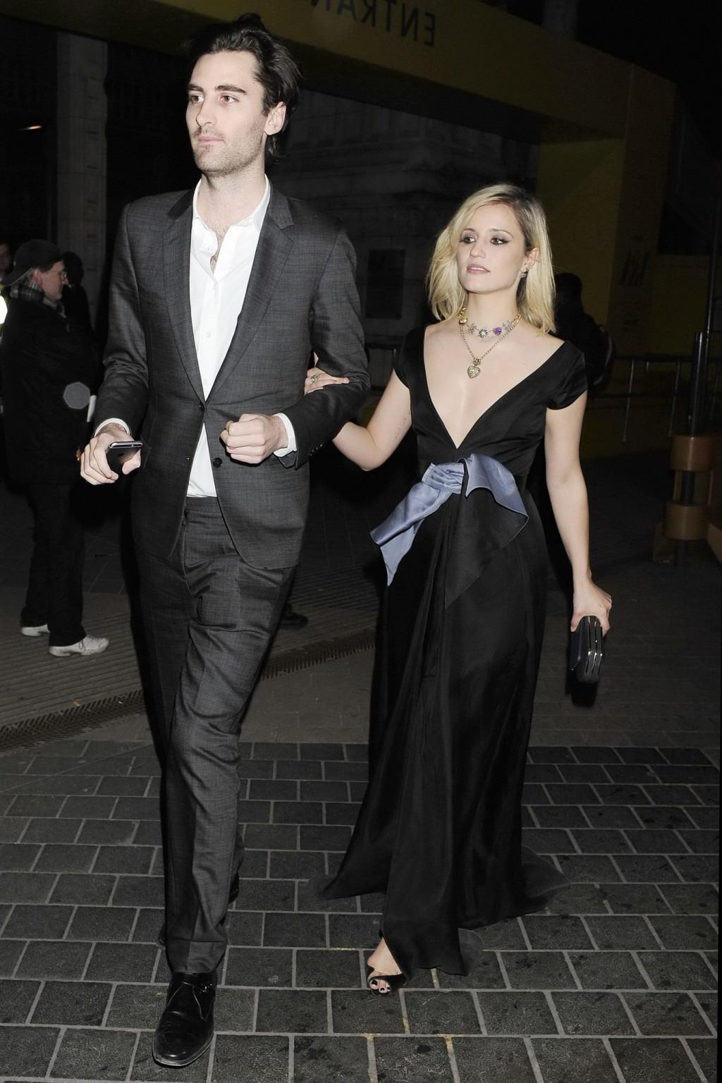 16P Dianna Agron nipple slip in a low cut black dress while arriving at Alexander Mc
