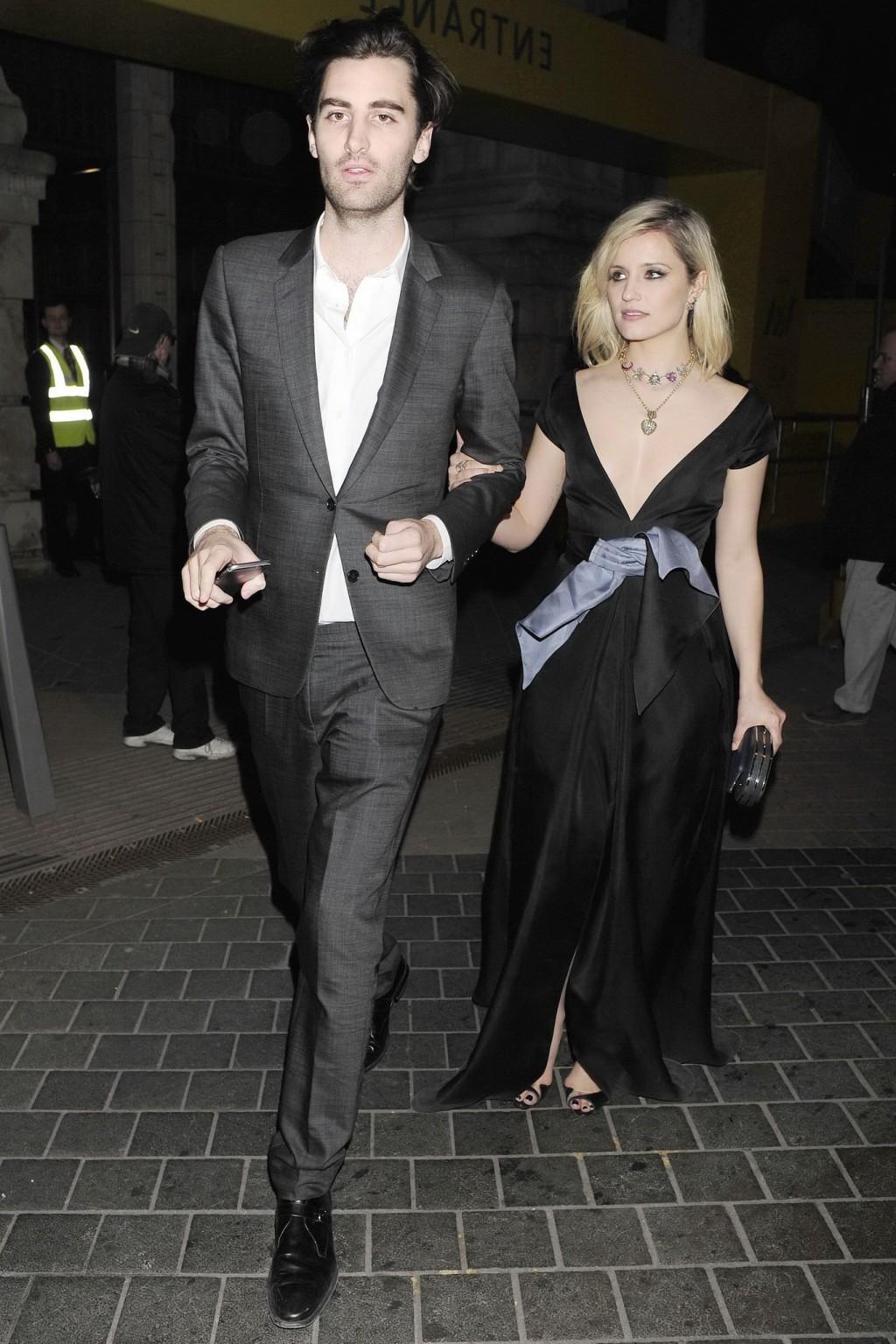 16P Dianna Agron nipple slip in a low cut black dress while arriving at Alexander Mc