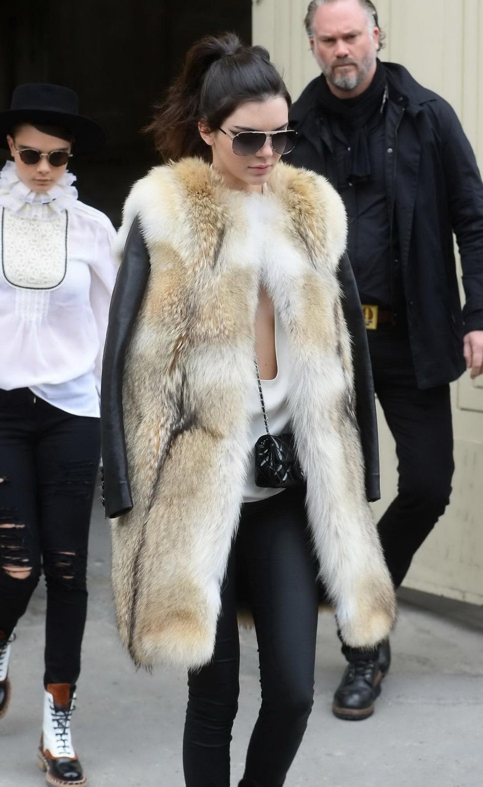 16P Kendall Jenner braless shows huge cleavage while leaving the Chanel Fashion Show