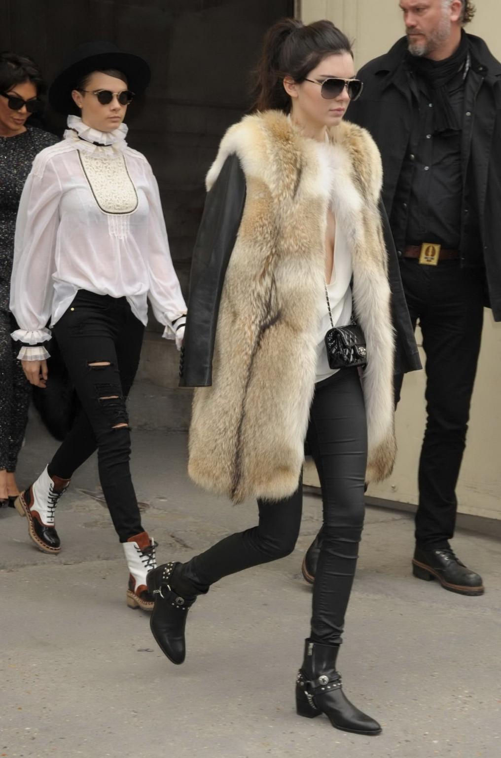16P Kendall Jenner braless shows huge cleavage while leaving the Chanel Fashion Show