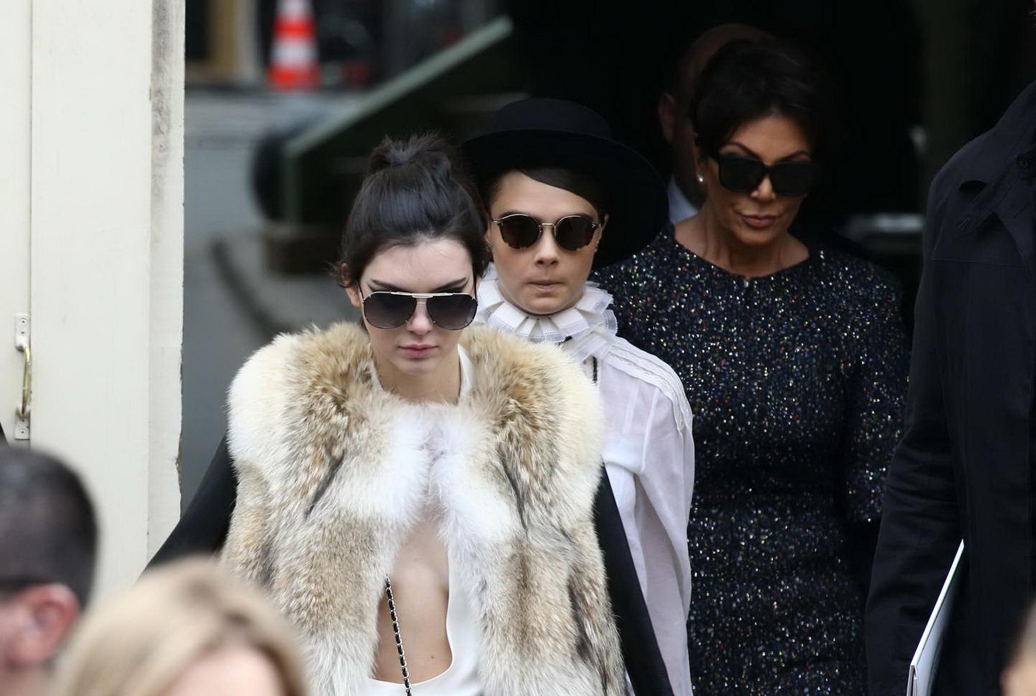 16P Kendall Jenner braless shows huge cleavage while leaving the Chanel Fashion Show
