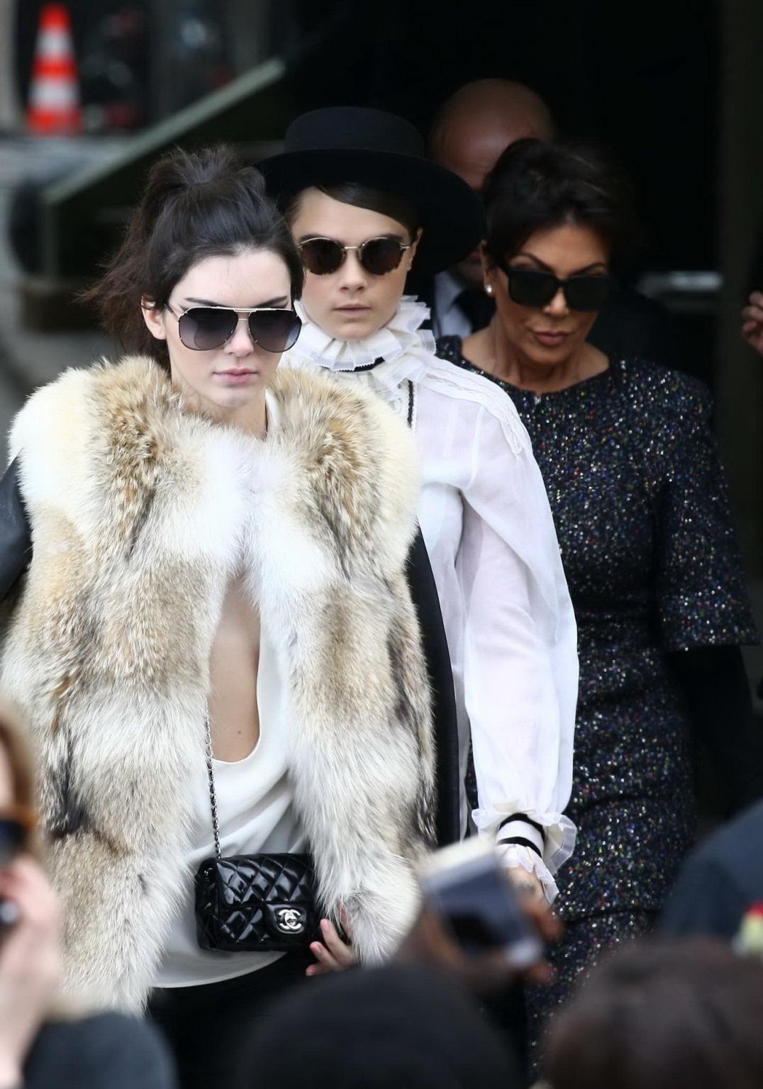 16P Kendall Jenner braless shows huge cleavage while leaving the Chanel Fashion Show