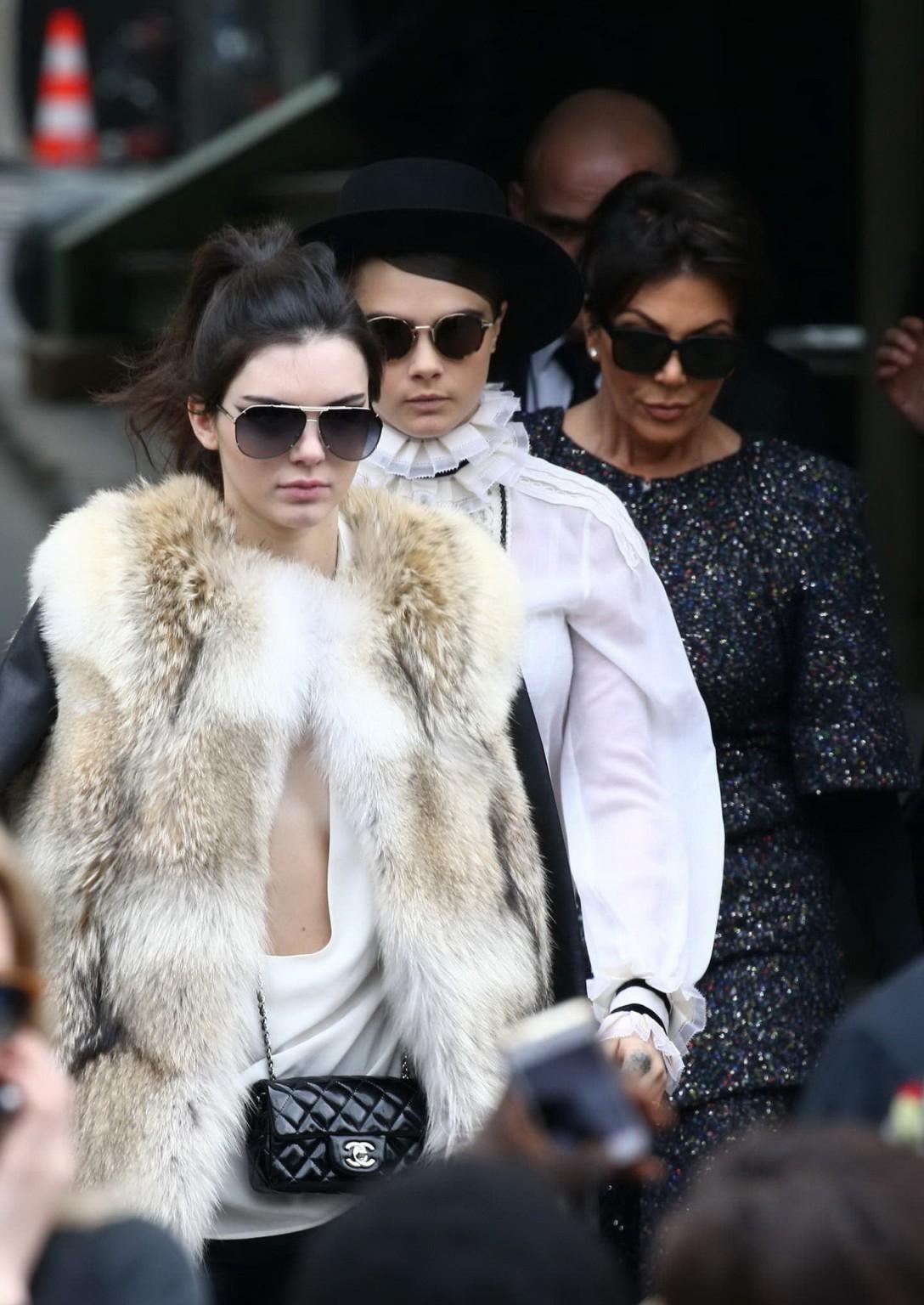 16P Kendall Jenner braless shows huge cleavage while leaving the Chanel Fashion Show