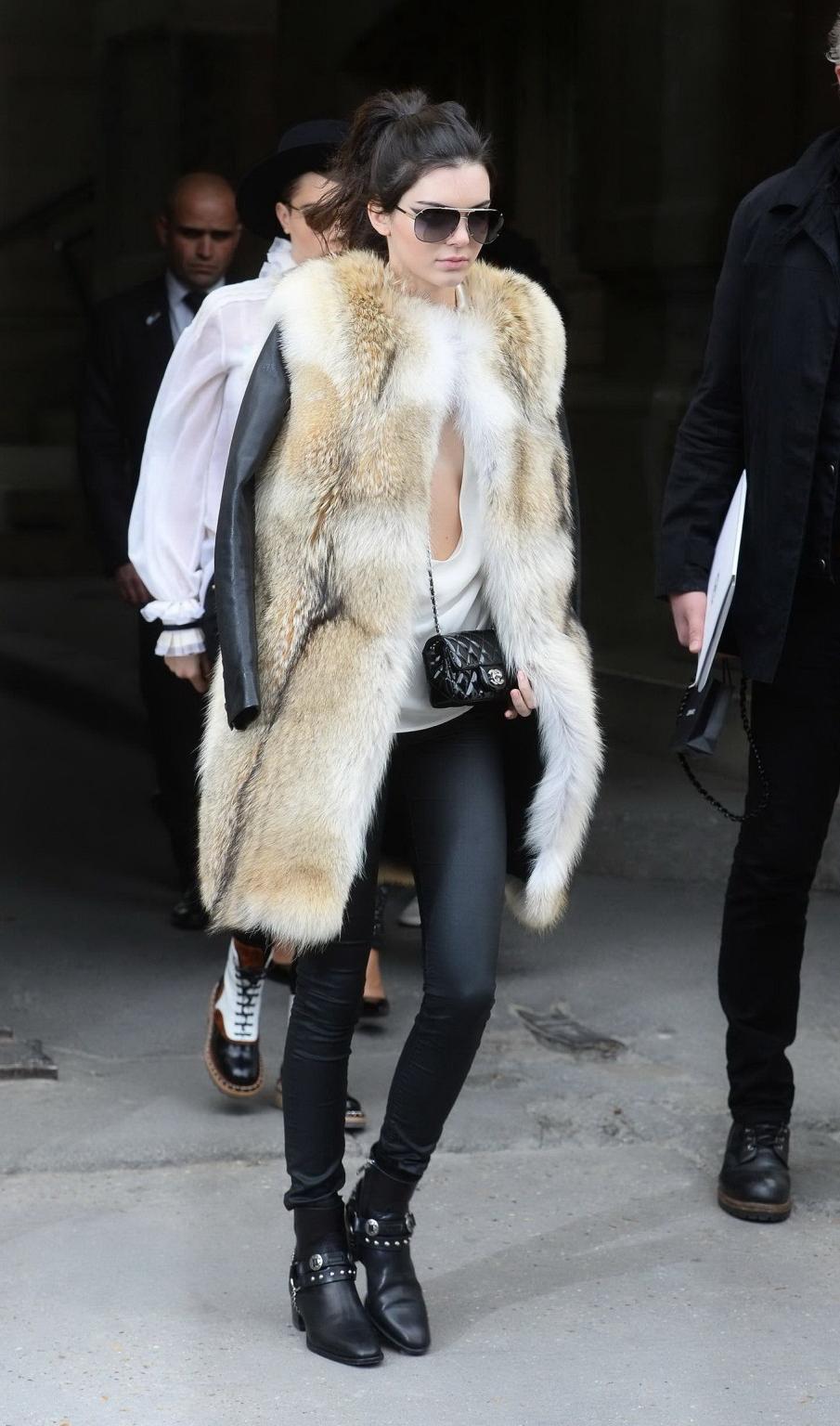 16P Kendall Jenner braless shows huge cleavage while leaving the Chanel Fashion Show