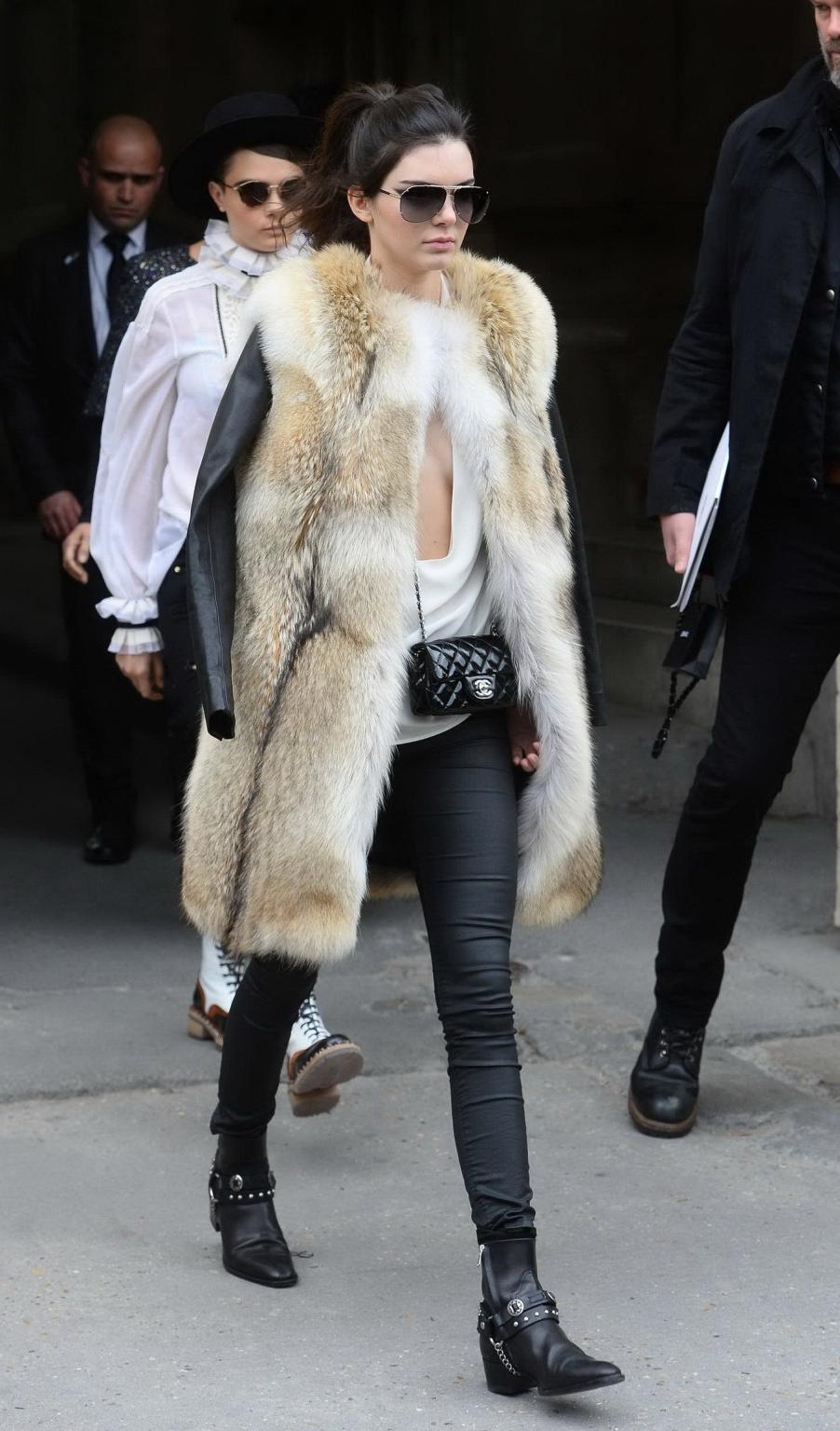 16P Kendall Jenner braless shows huge cleavage while leaving the Chanel Fashion Show