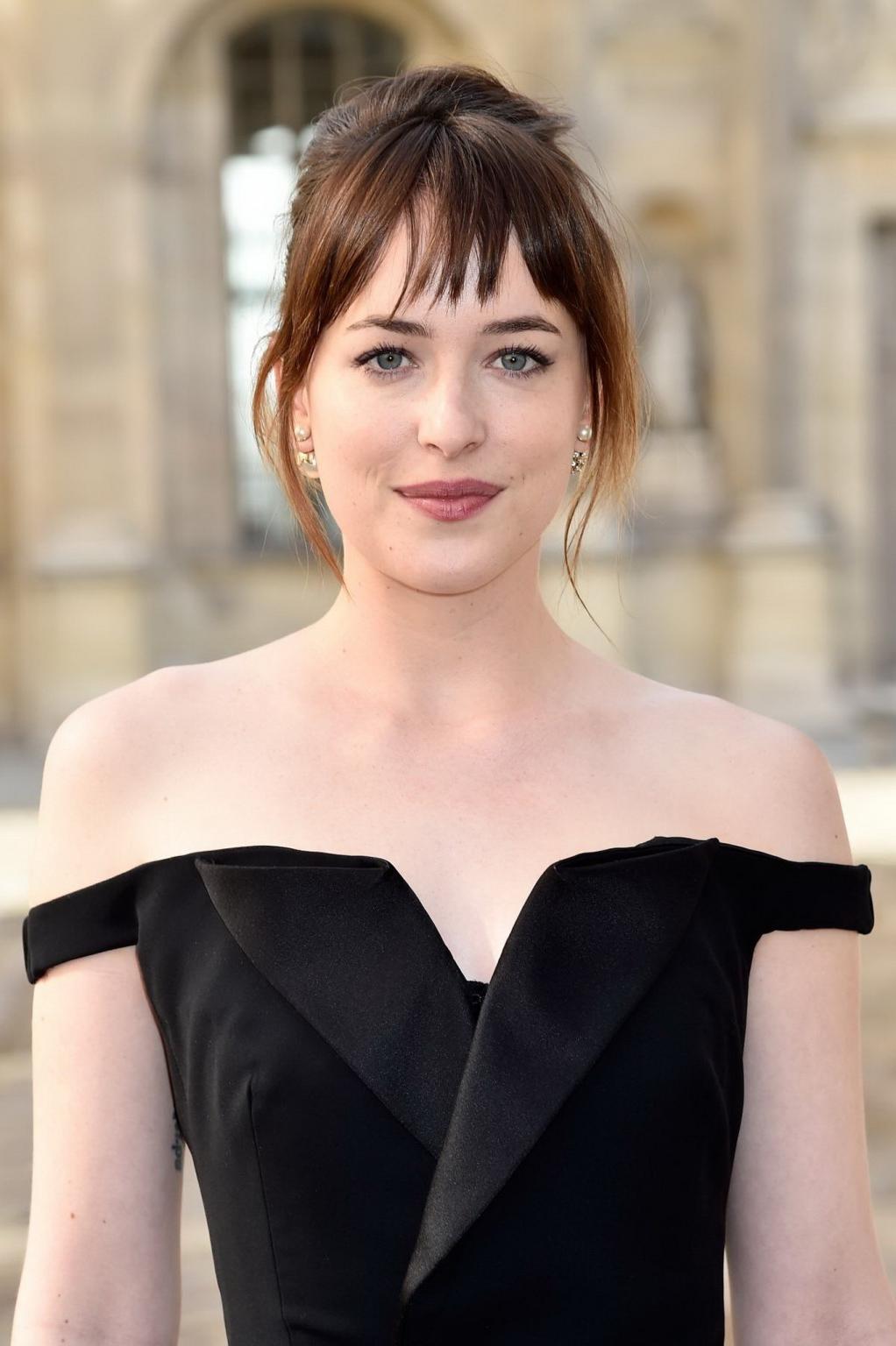 16P Dakota Johnson showing big cleavage in black jumpsuit at Christian Dior Fashion 