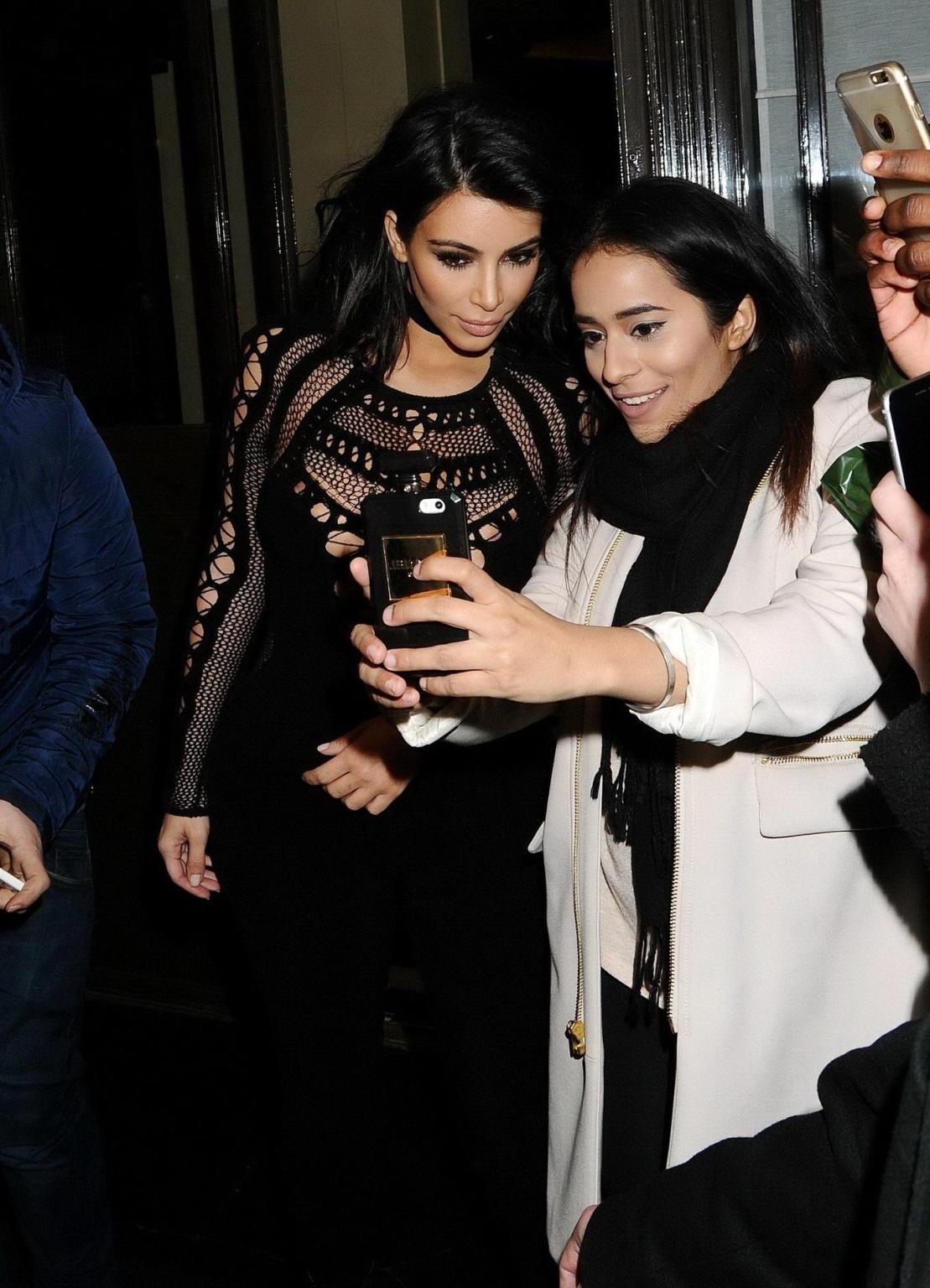 16P Kim Kardashian nip slip wearing a mesh jumpsuit at the BRIT Awards Arrivals and 