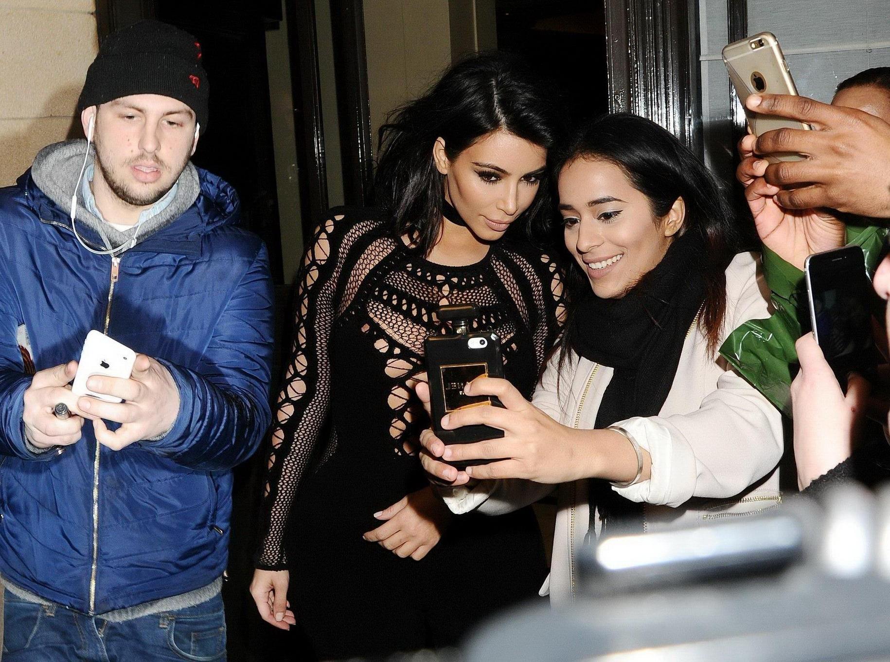 16P Kim Kardashian nip slip wearing a mesh jumpsuit at the BRIT Awards Arrivals and 