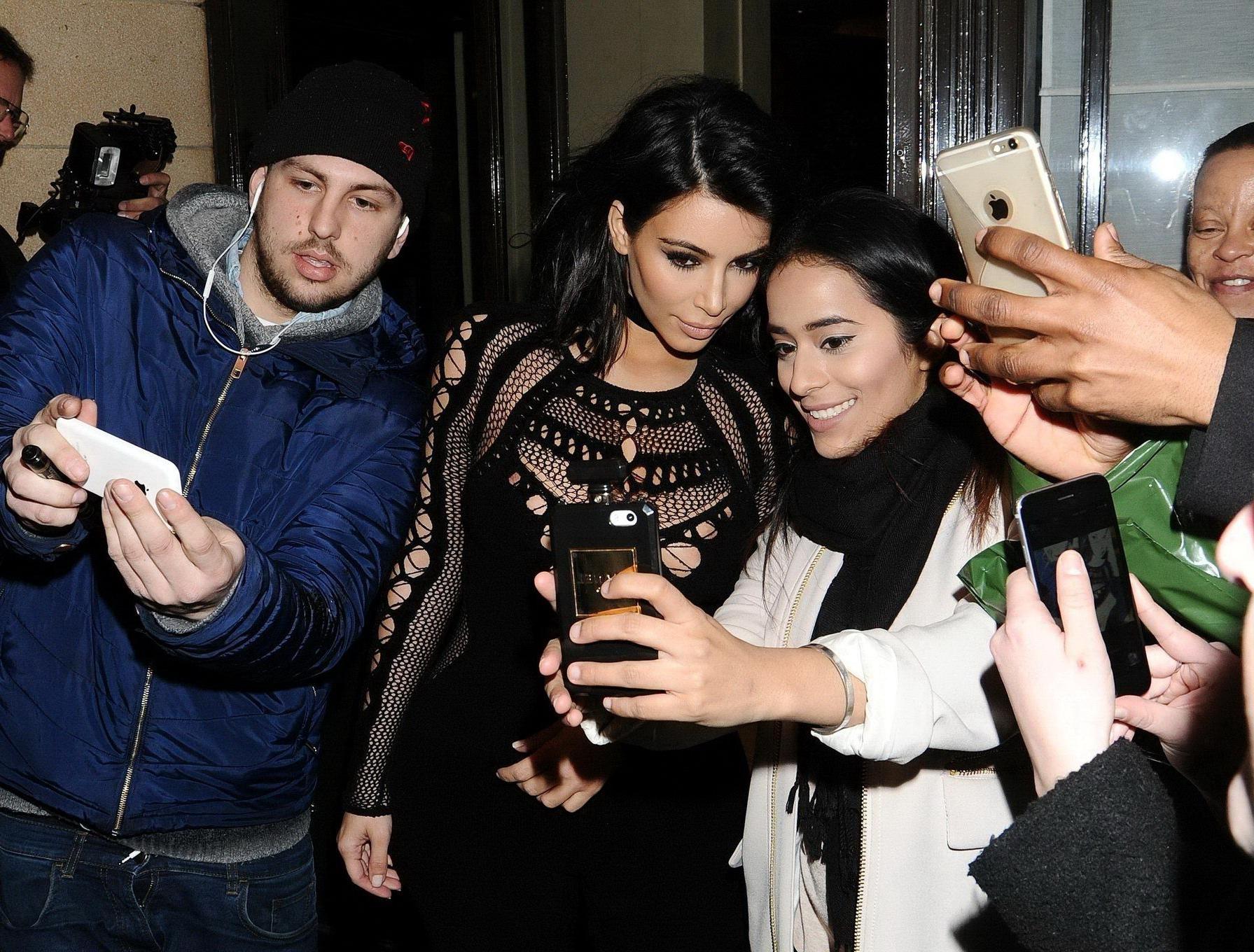 16P Kim Kardashian nip slip wearing a mesh jumpsuit at the BRIT Awards Arrivals and 