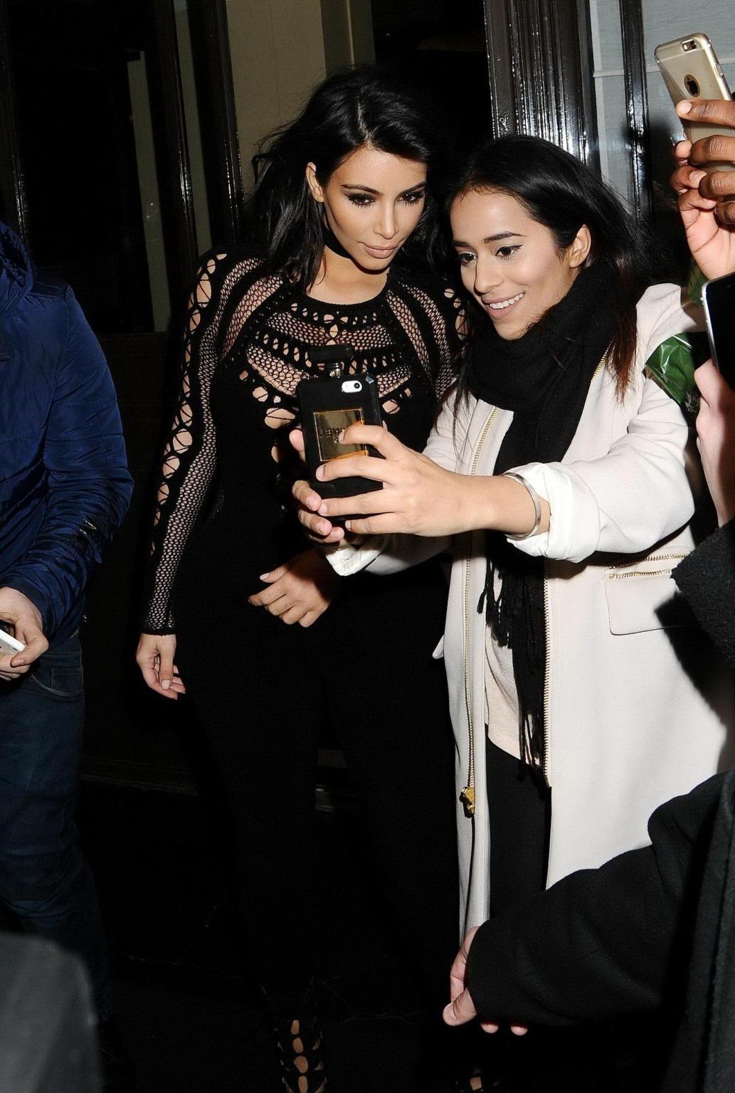 16P Kim Kardashian nip slip wearing a mesh jumpsuit at the BRIT Awards Arrivals and 