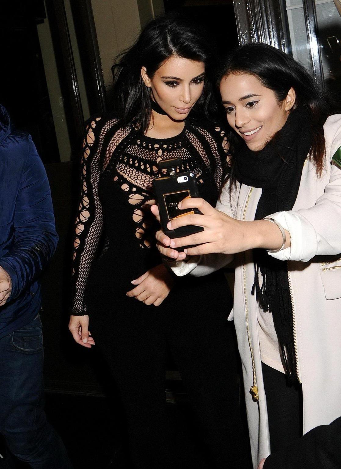 16P Kim Kardashian nip slip wearing a mesh jumpsuit at the BRIT Awards Arrivals and 