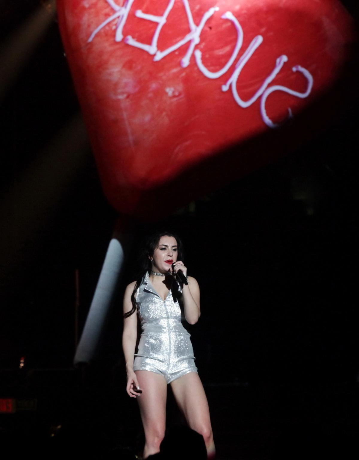 16P Charli XCX shows off her ass and cleavage wearing a silver bodysuit on the Prism