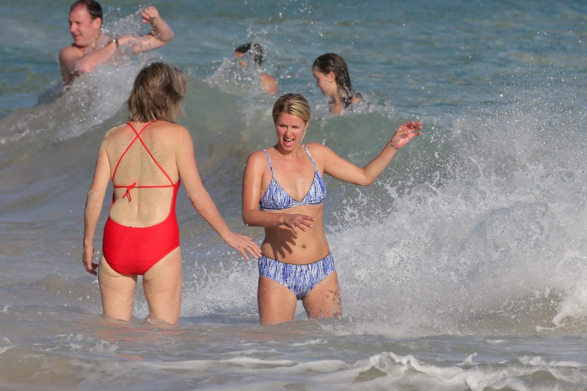 16P Nicky Hilton booty wearing blue retro bikini at some Caribbean beach