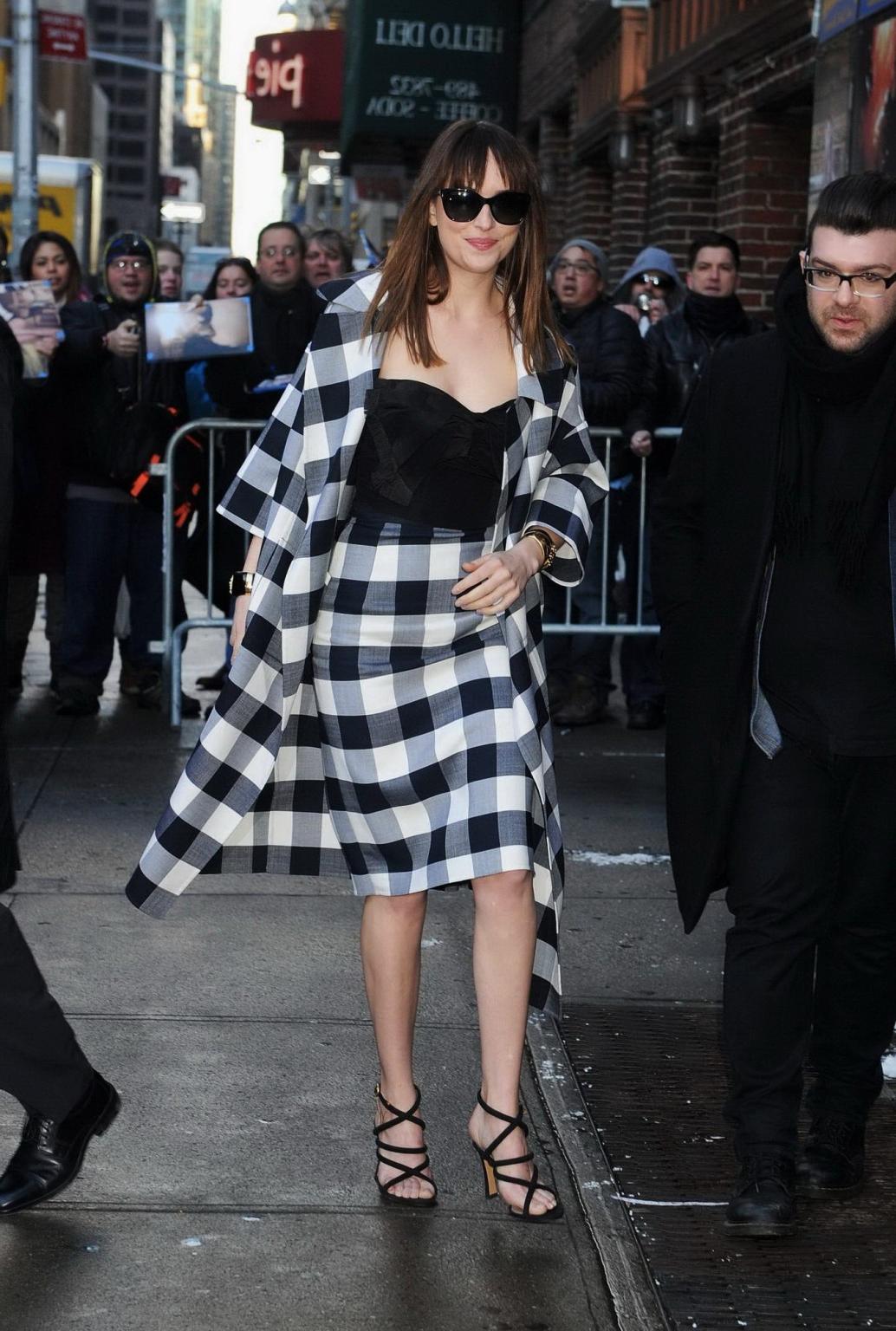 16P Dakota Johnson busty shows big cleavage while heading at The Late Show with Davi