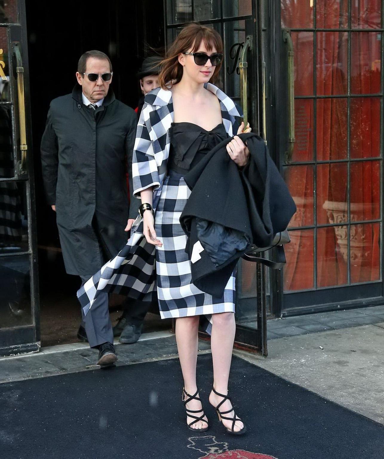 16P Dakota Johnson busty shows big cleavage while heading at The Late Show with Davi