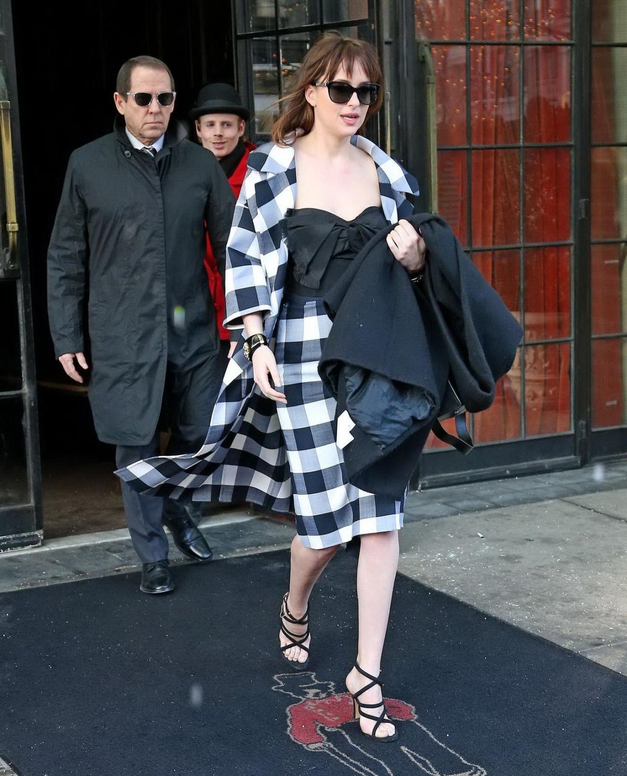 16P Dakota Johnson busty shows big cleavage while heading at The Late Show with Davi