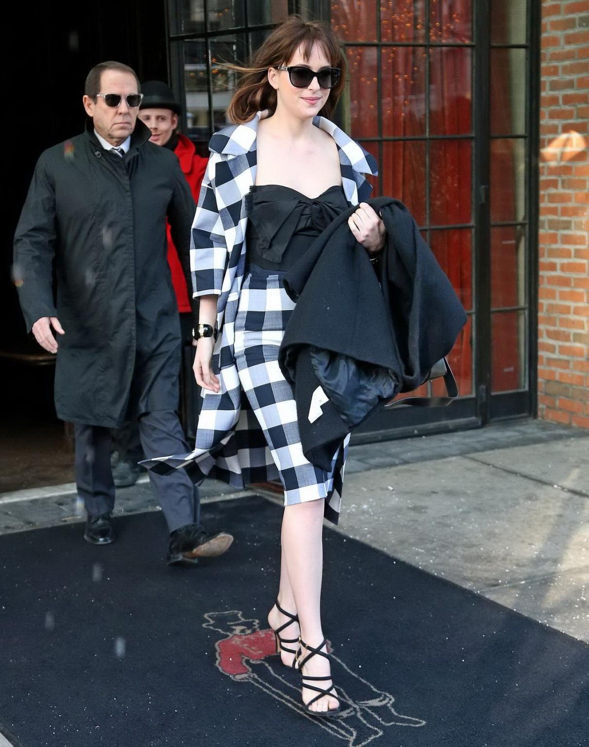 16P Dakota Johnson busty shows big cleavage while heading at The Late Show with Davi