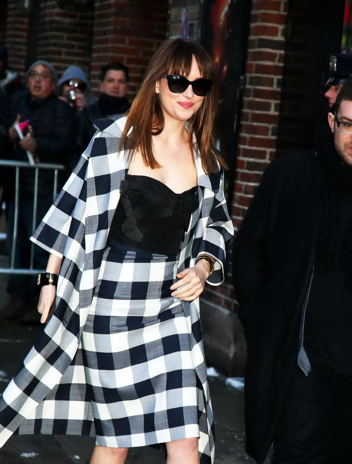 16P Dakota Johnson busty shows big cleavage while heading at The Late Show with Davi