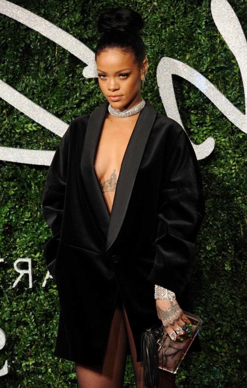 16P Rihanna braless showing cleavage at the British Fashion Awards in London