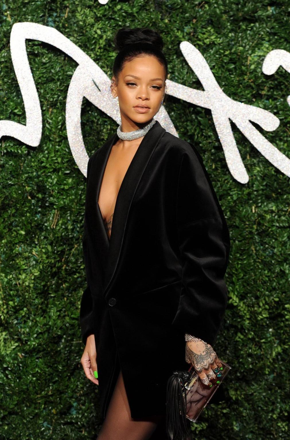 16P Rihanna braless showing cleavage at the British Fashion Awards in London