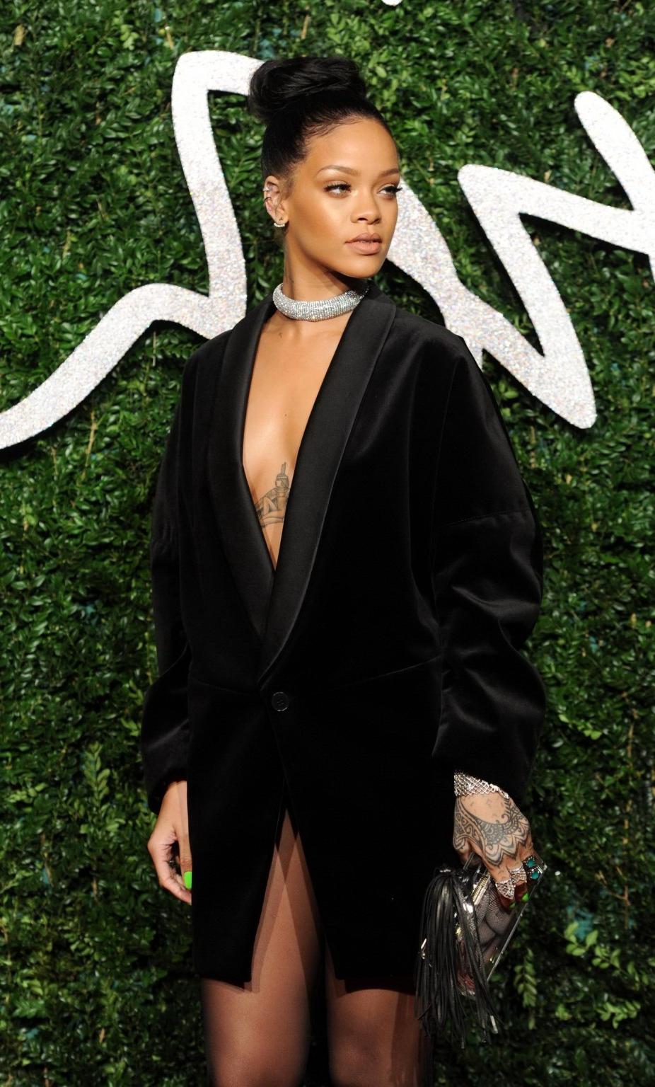 16P Rihanna braless showing cleavage at the British Fashion Awards in London